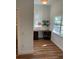 Home office featuring hardwood floors, a built-in desk, and natural light from a large window at 1611 Chestnut Ave, Winter Park, FL 32789