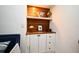 Custom built-in cabinets with wooden countertop, providing ample storage and display space, beautifully designed at 1611 Chestnut Ave, Winter Park, FL 32789
