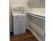 Cozy walk-in closet with white mirrored dresser, ample storage and closet rod at 1611 Chestnut Ave, Winter Park, FL 32789