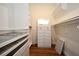 Large walk-in closet with custom organizers, drawers, shelves, hanging rods, and dresser at 1611 Chestnut Ave, Winter Park, FL 32789