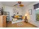 Bright bedroom with a ceiling fan, decorative pillows, neutral walls, and a window with natural lighting at 22 Sweetwater Creek Cir, Oviedo, FL 32765