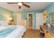 Spacious bedroom with ceiling fan, carpet, and ensuite bathroom access at 22 Sweetwater Creek Cir, Oviedo, FL 32765