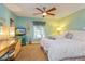 Serene bedroom with a ceiling fan, a window with drapes, and a TV at 22 Sweetwater Creek Cir, Oviedo, FL 32765