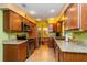 Well-equipped kitchen with granite countertops, stainless steel appliances, and wooden cabinets at 22 Sweetwater Creek Cir, Oviedo, FL 32765