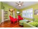 Comfortable living room with a vaulted ceiling, hardwood floors, and natural light from the shuttered windows at 22 Sweetwater Creek Cir, Oviedo, FL 32765