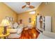 Cozy living room with vaulted ceilings, wood floors, and lots of natural light at 22 Sweetwater Creek Cir, Oviedo, FL 32765