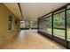 Large screened patio with tiled floors, a covered ceiling, and views of the lush backyard at 22 Sweetwater Creek Cir, Oviedo, FL 32765