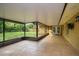 Spacious screened patio with tiled floors, covered ceiling, and views of a well-maintained backyard at 22 Sweetwater Creek Cir, Oviedo, FL 32765