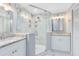 Beautifully renovated bathroom featuring double sinks and a glass shower at 2208 Page Ave, Orlando, FL 32806