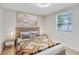 Cozy bedroom with modern decor and large window at 2208 Page Ave, Orlando, FL 32806