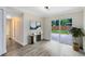 Hallway featuring hardwood floors and sliding glass doors to the backyard at 2208 Page Ave, Orlando, FL 32806