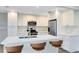 Contemporary kitchen with white cabinets, stainless steel appliances, and a spacious center island at 2208 Page Ave, Orlando, FL 32806