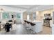 Modern kitchen with white cabinets, stainless steel appliances, and an island with bar stool seating at 2208 Page Ave, Orlando, FL 32806