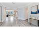 Spacious living room features modern gray wood flooring and an open floor plan at 2208 Page Ave, Orlando, FL 32806