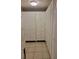 Long closet with white louvered doors, tiled floors and a utility sink at 2215 Hontoon Rd., Deland, FL 32720