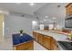 Open-concept kitchen with an island, bar seating, and views into living space at 27 Foxhunter Flt, Ormond Beach, FL 32174