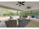 Spacious screened lanai with modern furniture, ceiling fans and an outdoor grill at 27 Foxhunter Flt, Ormond Beach, FL 32174