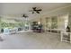 Large screened lanai with ceiling fans, tile floor and kayaks for outdoor enjoyment at 27 Foxhunter Flt, Ormond Beach, FL 32174