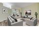 Bright living room offering comfortable seating and sliding doors to the outdoors at 27 Foxhunter Flt, Ormond Beach, FL 32174
