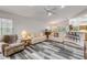 Inviting living room with vaulted ceiling, nice flooring, and plenty of seating for Gathering and friends at 27 Foxhunter Flt, Ormond Beach, FL 32174