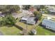 An aerial view of a home on a corner lot, with a fenced yard and mature trees at 2814 Bonneville Dr, Orlando, FL 32826