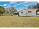 Large backyard with a privacy fence and a well-maintained lawn, offering ample space for outdoor activities at 2814 Bonneville Dr, Orlando, FL 32826