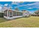 Expansive backyard featuring a screened lanai, offering an ideal space for outdoor relaxation and entertainment at 2814 Bonneville Dr, Orlando, FL 32826