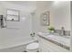 Bright bathroom with a shower-tub combo and granite-topped vanity at 2814 Bonneville Dr, Orlando, FL 32826