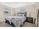 Inviting bedroom with a comfortable queen-size bed and ample natural light at 2814 Bonneville Dr, Orlando, FL 32826
