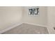 Empty, carpeted bedroom with two windows providing natural light at 2814 Bonneville Dr, Orlando, FL 32826