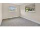 Neutral bedroom with plush carpeting and two windows for natural light at 2814 Bonneville Dr, Orlando, FL 32826