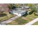Charming single story home with mature landscaping, and a covered patio and fenced yard at 2814 Bonneville Dr, Orlando, FL 32826
