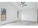 Bright bedroom with vaulted ceiling, ceiling fan, and multiple windows at 305 Haverlake Cir, Apopka, FL 32712