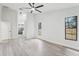 Spacious bedroom featuring a ceiling fan and an ensuite bathroom at 305 Haverlake Cir, Apopka, FL 32712
