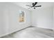Bright bedroom with a ceiling fan and wood-look flooring, offering a cozy and modern aesthetic at 305 Haverlake Cir, Apopka, FL 32712