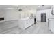 Spacious kitchen featuring an island with white countertops and modern appliances at 305 Haverlake Cir, Apopka, FL 32712