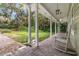 Spacious front porch featuring brick flooring, rocking chairs, and white pillars at 3450 Whitner Way, Sanford, FL 32773