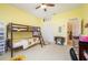 Bedroom with yellow walls, bunk bed and built in shelving at 398 Pine Tree Rd, Lake Mary, FL 32746