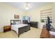 Bedroom with large bed, natural light and ceiling fan at 398 Pine Tree Rd, Lake Mary, FL 32746