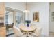 A charming dining area off the kitchen features a round table and sliding glass doors that lead to the lanai at 398 Pine Tree Rd, Lake Mary, FL 32746