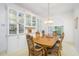 Elegant dining room featuring beautiful built-in display cabinets at 398 Pine Tree Rd, Lake Mary, FL 32746