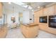 This kitchen features an island, modern appliances, and an adjacent dining area with a view to the patio at 398 Pine Tree Rd, Lake Mary, FL 32746