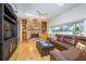Inviting living room features a brick fireplace and plenty of natural light at 398 Pine Tree Rd, Lake Mary, FL 32746
