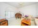 Serene living room with large window and a grand piano at 398 Pine Tree Rd, Lake Mary, FL 32746