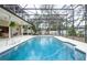 Sparkling screened-in pool with ample patio space for lounging and entertaining at 398 Pine Tree Rd, Lake Mary, FL 32746