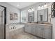 Bright bathroom featuring a soaking tub, separate shower, and double sink vanity at 4160 Golden Willow Cir, Apopka, FL 32712
