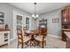 Cozy breakfast nook with a charming table and chairs, and French doors to the patio at 4160 Golden Willow Cir, Apopka, FL 32712