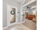 Inviting foyer with a decorative glass front door leading to the home office at 4160 Golden Willow Cir, Apopka, FL 32712