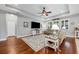 Cozy living room featuring hardwood floors, tray ceiling, and plush seating at 4160 Golden Willow Cir, Apopka, FL 32712