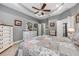 Charming main bedroom featuring a decorative ceiling fan and ensuite bathroom access at 4160 Golden Willow Cir, Apopka, FL 32712